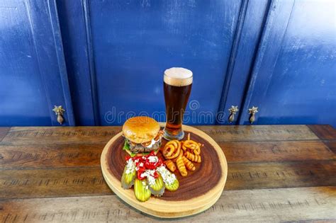 Gourmet Grilled Burger with Bacon and Gorgonzola Cheese on a Brioche Bun with Beer Stock Photo ...