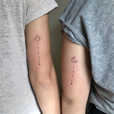 Matching sun and crescent moon tattoos on upper arms | Tattoos for ...