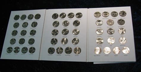 259. (50) State Complete Commemorative Quarter Set in Marcus Coin Book.