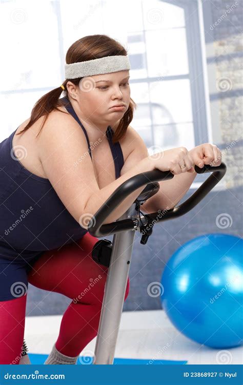 Exhausted Fat Woman On Exercise Bike Royalty Free Stock Photography ...