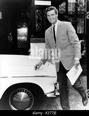 THE SAINT Roger Moore as Simon Templar and Vivienne Ventura in the Stock Photo: 6446308 - Alamy