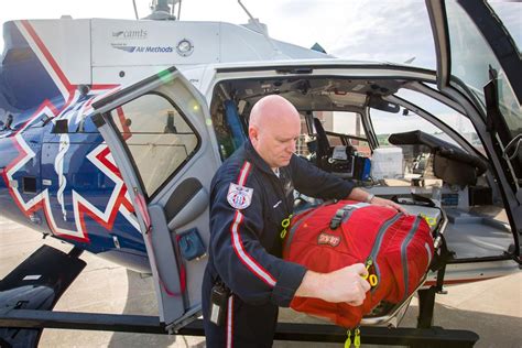 As helicopter flight nurse, he saves lives in a cramped ER 2,000 feet in the air, at 140 mph ...