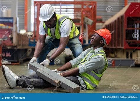 Industrial Accident Concept. Male African American Accidents from Working Carrying Heavy Objects ...