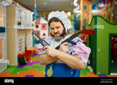 Funny baby man criminal posing with toy weapon Stock Photo - Alamy