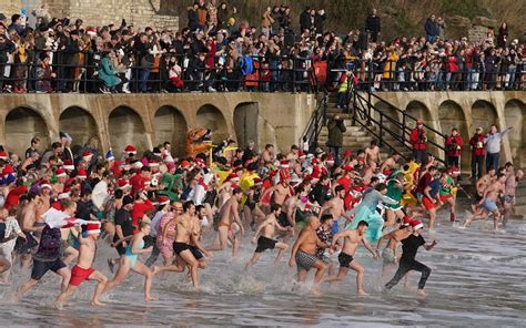 Swimmers don festive outfits for Boxing Day dips for good causes ...