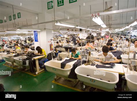 SHENZHEN GUANGDONG PROVINCE CHINA Workers in a garment factory in city ...