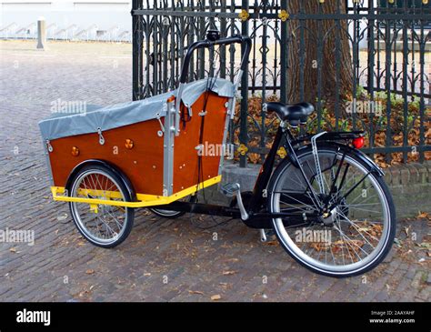 typical bicycles with front carriage in holland, europe Stock Photo - Alamy