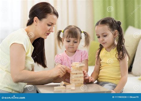 Family at the Table Playing Board Game Stock Photo - Image of parent, love: 111903330