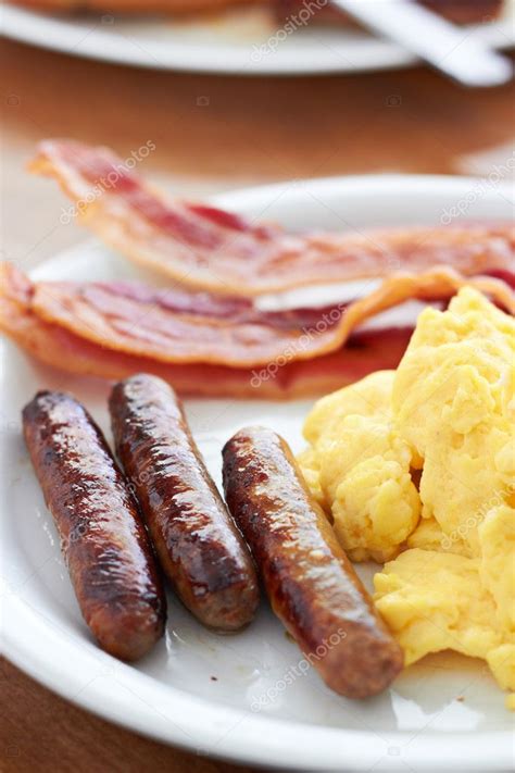 Sausage links with scrambled eggs and bacon — Stock Photo © resnick_joshua1 #8632964