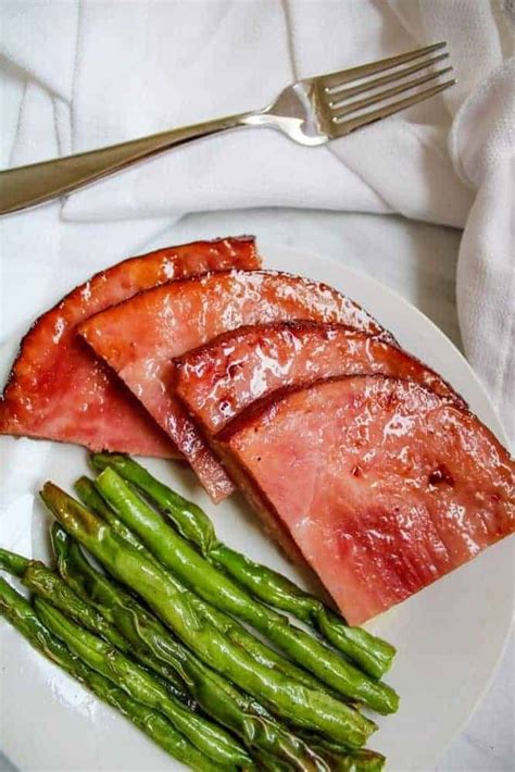 The best air fryer ham steak recipe. Enjoy this brown sugar ham steak cooked in an air fryer in ...