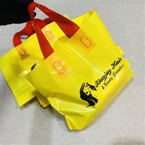 Custom printed portable plastic shopping bags with logo for clothing dress