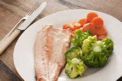 Two fresh salmon fillets in a frying pan - Free Stock Image