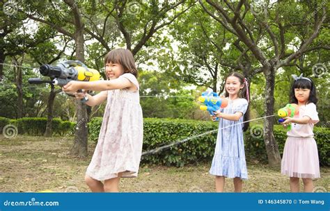 Children Playing with Water Guns on Summer Stock Photo - Image of ...