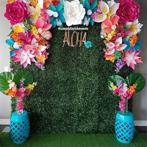 Hedge wall tropical paper flower backdrop perfect for luau. Follow us on Instagram ...