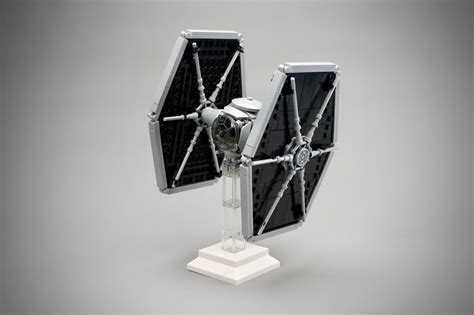 a star wars tie fighter model is shown on a white base and it's ...