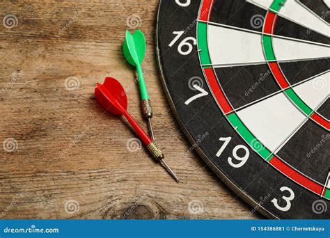 Dart Board with Color Arrows on Wooden Stock Image - Image of accuracy, darts: 154386881