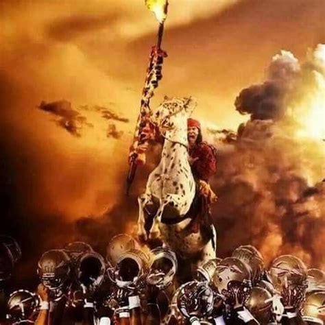 Chief Osceola and Renegade V over the top of team with helmets raised. | Florida state, Florida ...