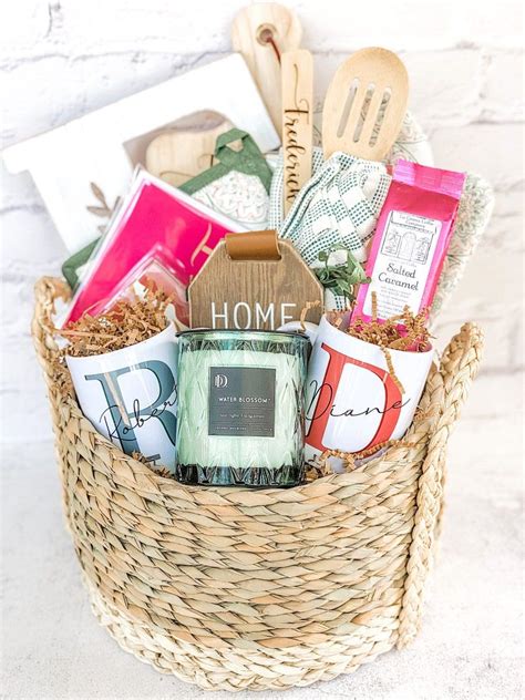 a basket filled with assorted items on top of a white brick wall next ...