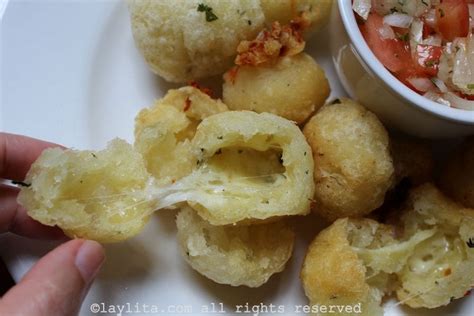 Brazilian manioc or cassava balls stuffed with cheese {Bolinho de ...