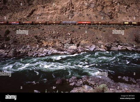 Cargo train through the Fraser river Canyon Stock Photo - Alamy