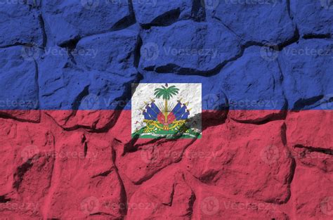 Haiti flag depicted in paint colors on old stone wall closeup. Textured ...