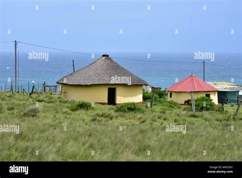 A colorful Xhosa round hut or house or rondavel with thatched roof ...