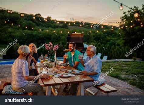 Happy Family Eating Together Outdoors Smiling Stock Photo 2068530107 | Shutterstock