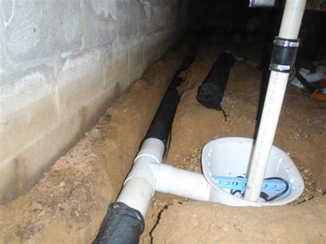 Crawl Space Repair - Hydrolink perimeter drainage system - "T-ing" into a SmartSump