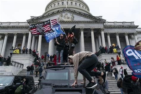 Capitol Riots Arrests: Two Men Charged For Spraying Police Officer ...