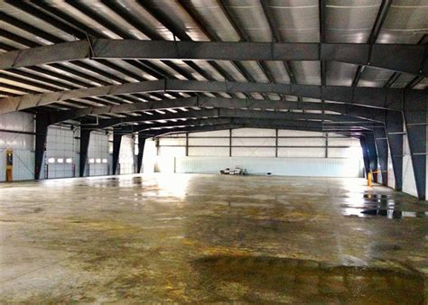 Prefab Steel Structure Warehouse Q235b Q345b Grade With Sliding Door