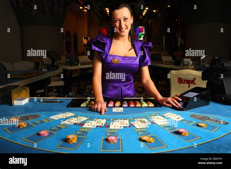 Smiling dealer, croupier showing cards in casino at blackjack table Stock Photo, Royalty Free ...