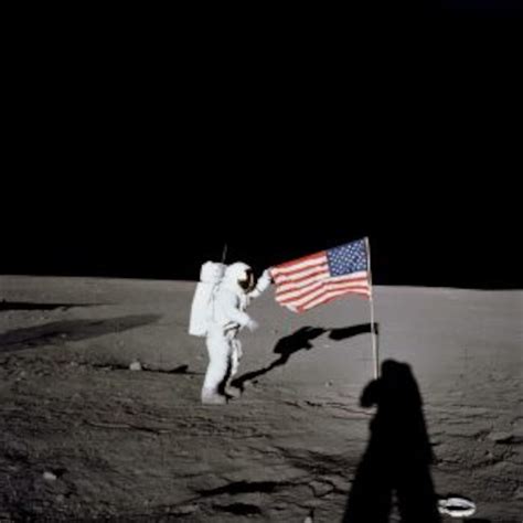 Astronaut On Moon By The American Flag