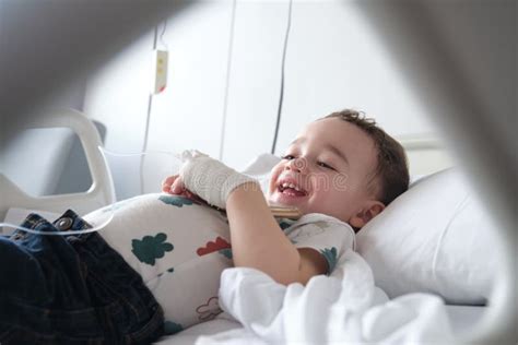 Child in Hospital Lying in Bed Stock Photo - Image of catheter, mobile: 266479236