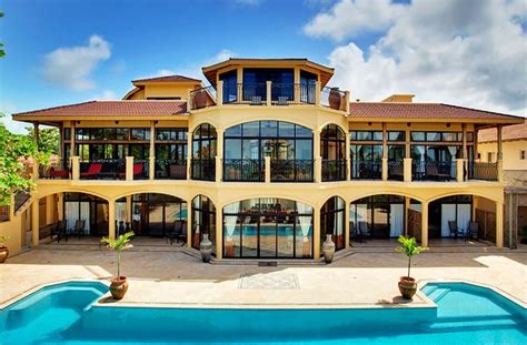 an image of a large house with lots of windows and balconies on the ...