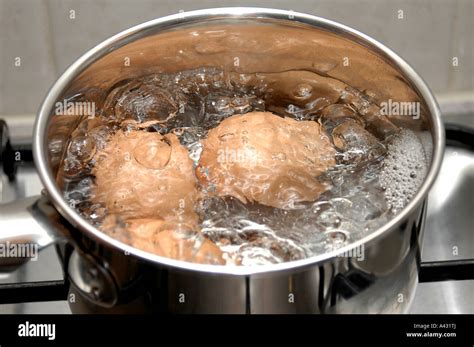 Stove Pot of boiling eggs Stock Photo - Alamy