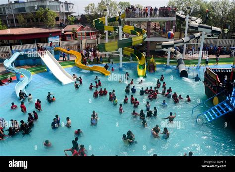 Peoples enjoy a ride at Dream Holiday Park in Narsingdi District ...