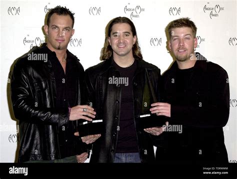 Jan 08, 2001; Los Angeles, CA, USA; Members of the band Creed (L to R) MIKE TREMONTI, SCOTT ...