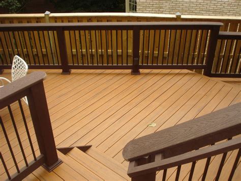 MD- Trex Woodland brown railing with black balusters on Teak PVC decking | Patio stain, Railings ...