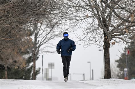 Photos: Snow falls and temperature drops in the Denver area