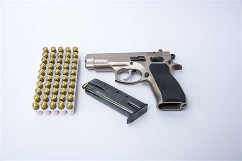 Premium Photo | Gun and ammunition isolated on white background.