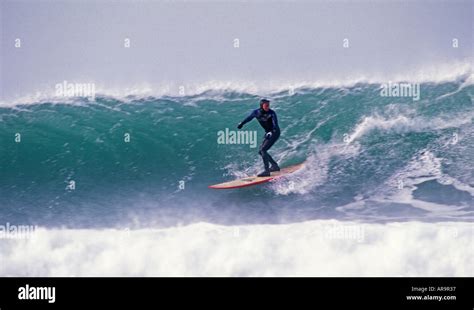 Surfing in Jersey Channel Islands Stock Photo - Alamy