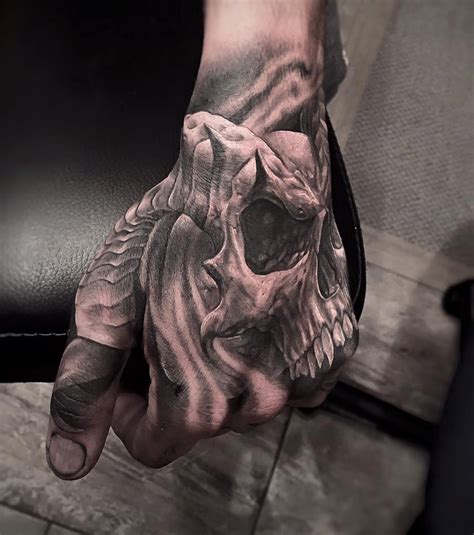 Horned Skull On Guys Hand | Best tattoo design ideas