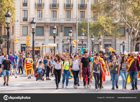 BARCELONA, SPAIN - OCTOBER 3, 2017: Demonstrators bearing catalan flags ...