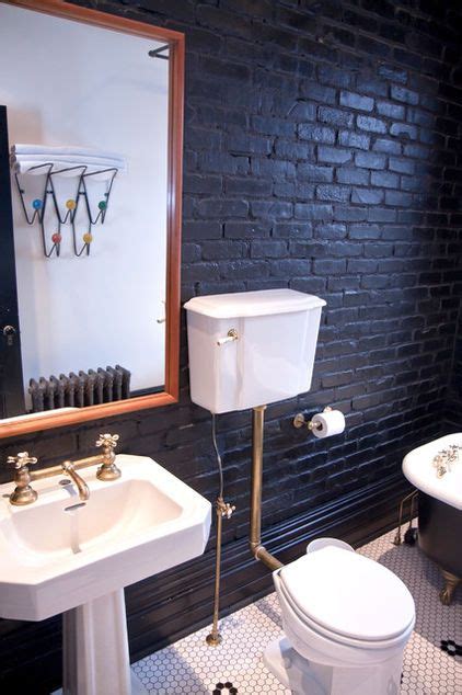 Dramatic black painted brick modernizes the second-floor bath, with its ...