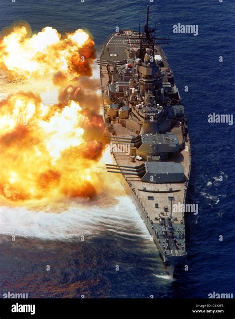 USS IOWA firing its Mark 7 16-inch/50-caliber guns off the starboard side during a fire power ...