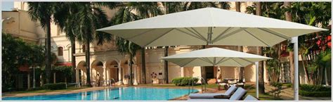 Cantilever umbrellas for commercial or residential use by Uhlmann.