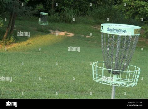 Disc (frisbee) golf baskets in a park in the U.S.A Stock Photo - Alamy