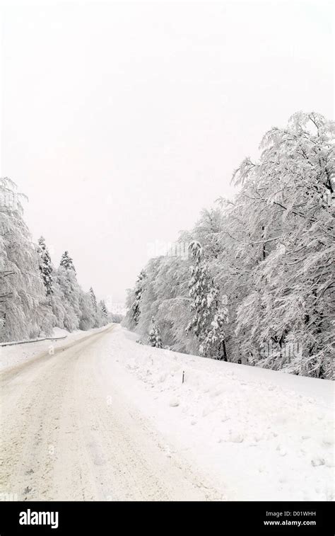 Traffic road in frost and snow, mountain, forest Stock Photo - Alamy