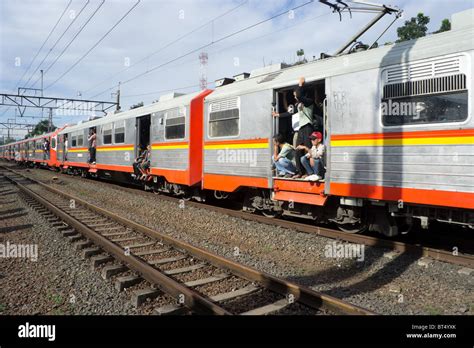 Commuter train in Jakarta, Indonesia near Pasar Minggu Station Stock ...