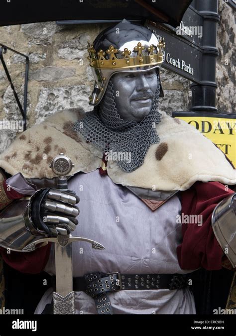 people dressed in medieval clothing as living history characters in the Derbyshire town of ...